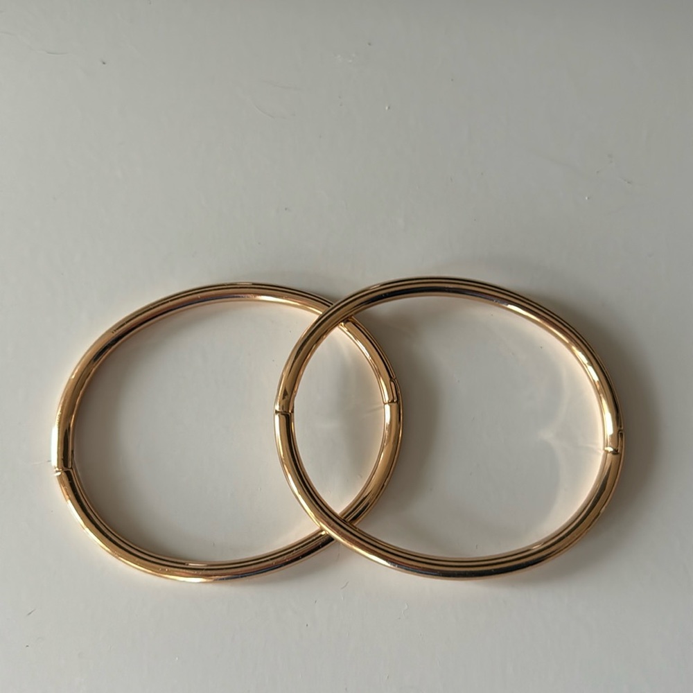 COS rose gold color bangles